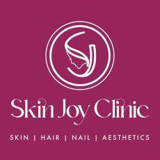 SKIN JOY CLINIC WITH DEVICE OF LADY logo