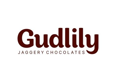 GUDLILY WITH TAG LINE JAGGERY CHOCOLATES logo